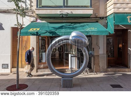 Campos, Balearic Islands/spain; October 2020: Elderly Man Walking Down The Street With A Shopping Ba