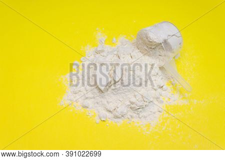 Pile Of Banana Protein Powder Isolated On Yellow Background