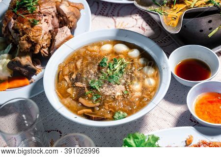 Chinese Style Soup; Or Braised Fish Maw In Red Gravy With Eggs, Mushroom, And Bamboo Shoot In White 