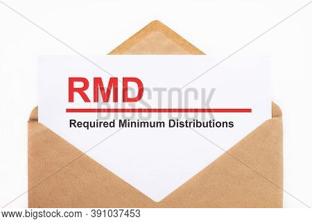 A White Sheet With The Text Rmd Lies In An Open Craft Envelope On A White Background With Copy Space