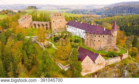 Velhartice / Czech Republic - October 20, 2019: Gothic castle Velhartice in National Park Sumava. Aerial view to medieval monument in Czech Republic. European landmarks from above. 