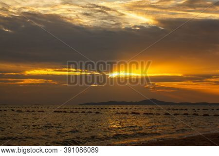 Pataya Sunset On The Beach. The Famous Tourist Attraction In Thailand.