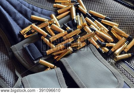 Ammunition 7,62*39.Tactical unloading vest as background. October 23, 2020.Kiev,Ukraine