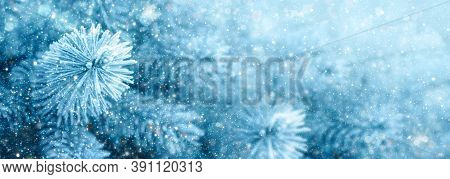 Cristmas Background With Pine Tree Branches And Snowfall.