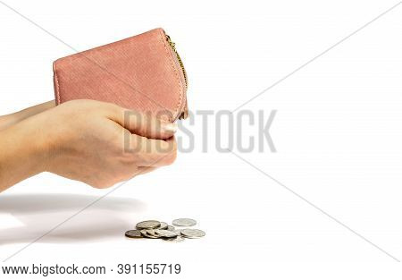 Womens Hands Shake Money Out Of An Empty Pink Wallet. White Isolated Background, Close-up, Selective