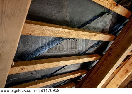 House Roof Made From Wood Planks And Black Slate Stone Plates