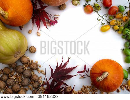 Theme With Walnuts Pumpkin Patyzone Leaves And Tomatoes On White Background