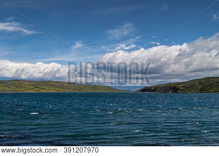 Punta Arenas, Chile - December 12, 2008: Blue Water Otway Sound Under Blue Sky With Large White Clou