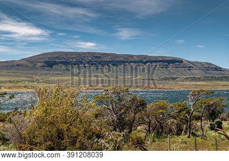 Riesco Island, Chile - December 12, 2008: Natural Straight Balcony Lines On Flank Of Mountain Behind