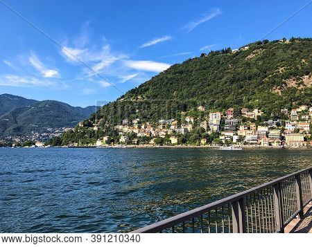 View To The City Of Como Over The Lake Como, On Summer Vacation In Lombardy, Italy