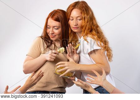 A Quick Snack That All Young People Love. Girls Holds A Bowl Of Chips In Hands And Does Not Share Wi