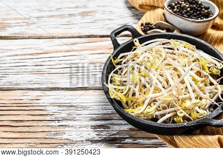 Raw White Organic Bean Sprouts In A Bowl. White Background. Top View. Copy Space