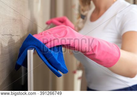 Beautiful Young Smiling Woman Cleaning House With Microfiber Cloth. Woman Cleaning Tv With Cleanser 