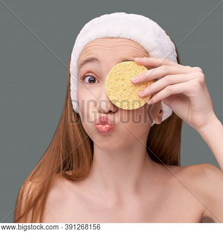Young Beauty Girl Remove Mascara. Face Sponge Cleaner. Ecology Nature Facial Product. Bathroom Home 