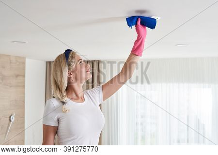 Maid Woman Holding Mop Pile, Cleaning Ceiling In Living Room. House Cleaning Service Concept.