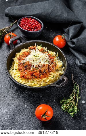 Orzo Pasta, Risone With Bolognese Sauce And Ground Beef. Black Background. Top View