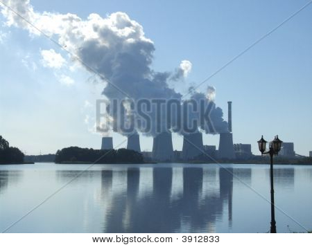 Power Station Reflecting In Sea