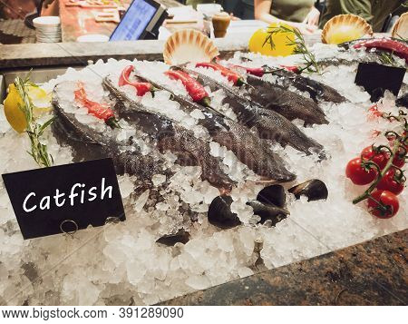 Beautifully Laid Decorated Fresh Catfish On Ice Stall In Restaurant