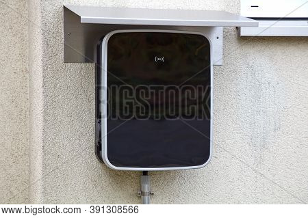 Wallbox On A House Wall For Simultaneous Charging Of Two Electric Cars.
