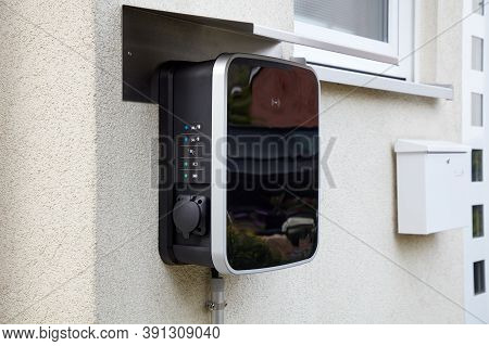 Wallbox On A House Wall For Simultaneous Charging Of Two Electric Cars.