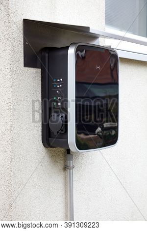 Wallbox On A House Wall For Simultaneous Charging Of Two Electric Cars.