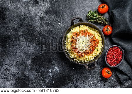 Orzo Pasta, Risone With Bolognese Sauce And Ground Beef. Black Background. Top View. Copy Space