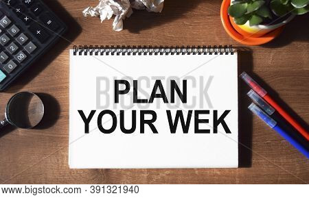 The Inscription Plan Your Wek Written In A Notebook, Against The Background Of Office Supplies. Top 