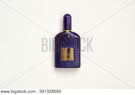 Tom Ford Velvet Orchid Fragrance Perfume Bottle Lies On Light Lilac Background. Tom Ford Is American