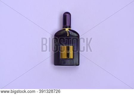 Tom Ford Velvet Orchid Fragrance Perfume Bottle Lies On Light Lilac Background. Tom Ford Is American