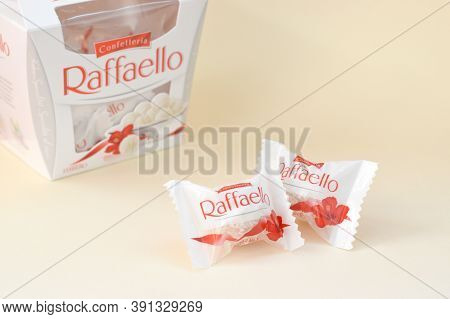 Raffaello Candies On Beige Background. Raffaello Is A Spherical Coconut Almond Confection That Itali