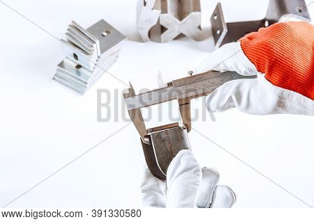 Measuring Inner Diameter, Outer Diameter, Length With A Caliper On A White Background.