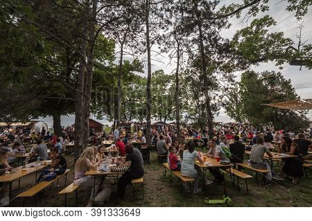 Belgrade, Serbia - May 26, 2019: Crowd Of Serbs Sitting And Drinking Beer In A Beergarden In Spring 