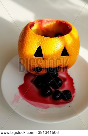 Healthy Fruit Halloween Treats. Pumpkinhead Jacks Made Of Orange Filled Berries