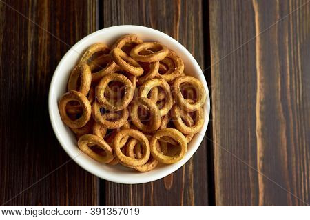 Russian Bagels In White Ceramic Bowl On Dark Rustic Table, Top View, Copy Space