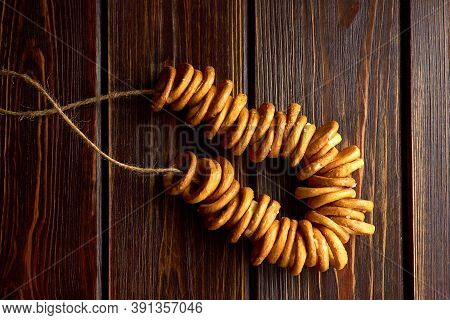 Traditional Russian Small Bagels On Dark Rustic Table Background, Top View