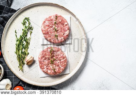Raw Chicken Cutlets, Ground Meat Patty. Organic Mince. White Background. Top View. Copy Space