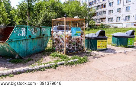 Novokuybyshevsk, Russia - July 3, 2020: Different Containers For Separate Waste Collection. Text In 