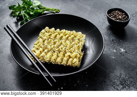 Dry, Raw Quick Cooking Noodle, Instant Noodles. Black Background. Top View