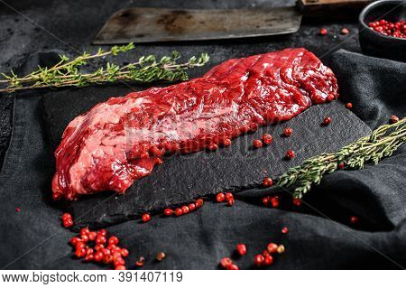 Raw Strip Vegas Beef Steak With Pink Pepper And Thyme. Black Background. Top View