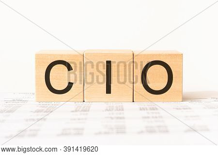 Word Cio. Wooden Small Cubes With Letters Isolated On White Background With Copy Space Available