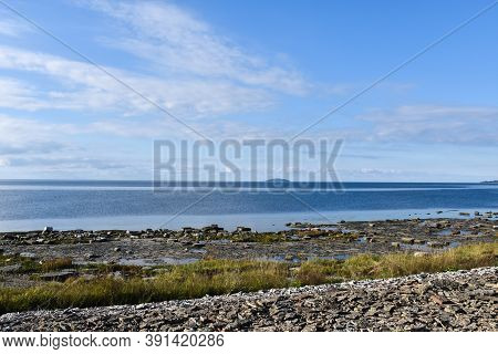 Flat Rocks Coast With The Swedish National Park Bla Jungfrun In The Horizon