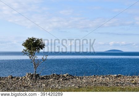 Coastal View At The Swedish  Island Bla Jungfrun In The Horizon