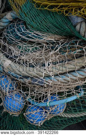 View On Fishermans Tackles And Nets Near Coastal Town Terracina, Latina, Italy On Sunset