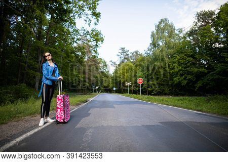 A Young Girl Stops By Hitchhiking To Shorten The Travel Time To The Arranged One. A Hot Day Can Be F