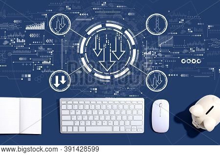 Descending Arrows With A Computer Keyboard And A Piggy Bank