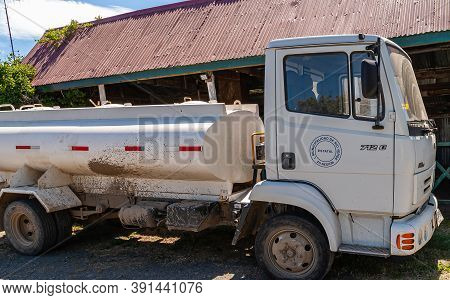 Riesco Island, Chile - December 12, 2008: White Tank Truck Property Of Rio Verde Township Parked On 