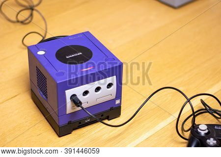 An Indigo Original Gamecube Console, A Popular Retro Console On A Wood Floor.