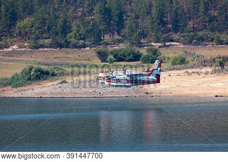 Lost Creek Lake Near Prospect,  Oregon / Usa - September 7, 2014:  A Small Fire Fighting Plane Prepa