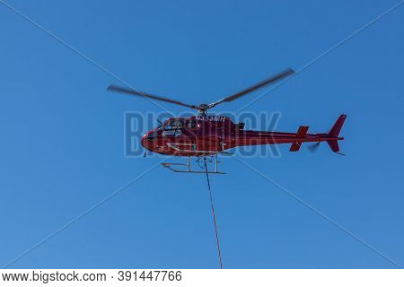 Prospect,  Oregon / Usa - September 9, 2014:  A Red Fire Fighting Helicopter Takes Off From Prospect