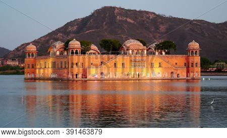 Evening Close Up Of Jal Mahal Palace Illuminated By Lights In Jaipur